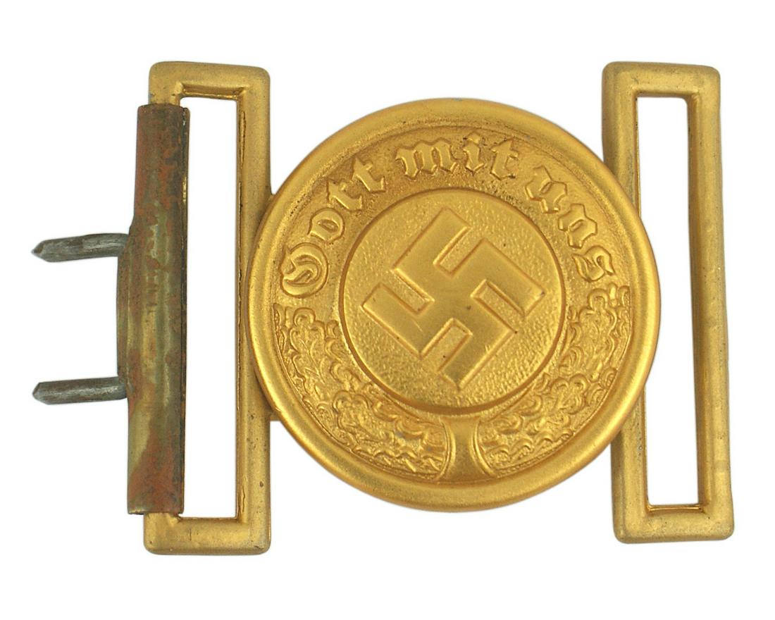 German WWII Water Police belt buckle: H-033 German WWII Water Police officer's belt buckle. Round gold aluminum disc with a relief swastika, "Gott mit uns" and oak leaves. Reverse marked with makers logo - "OLC" within a "diamond" on its 