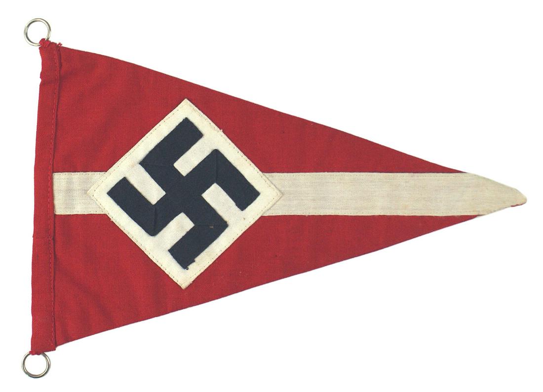 German WWII Hitler Youth Bicycle pennant: H-054 Hitler Youth Bicycle pennant. Black ribbon swastika sewn to a tilted white square - on a 6" x 9 1/4" red triangle with a 3/4" wide center stripe. Two metal rings for attaching to bike. II