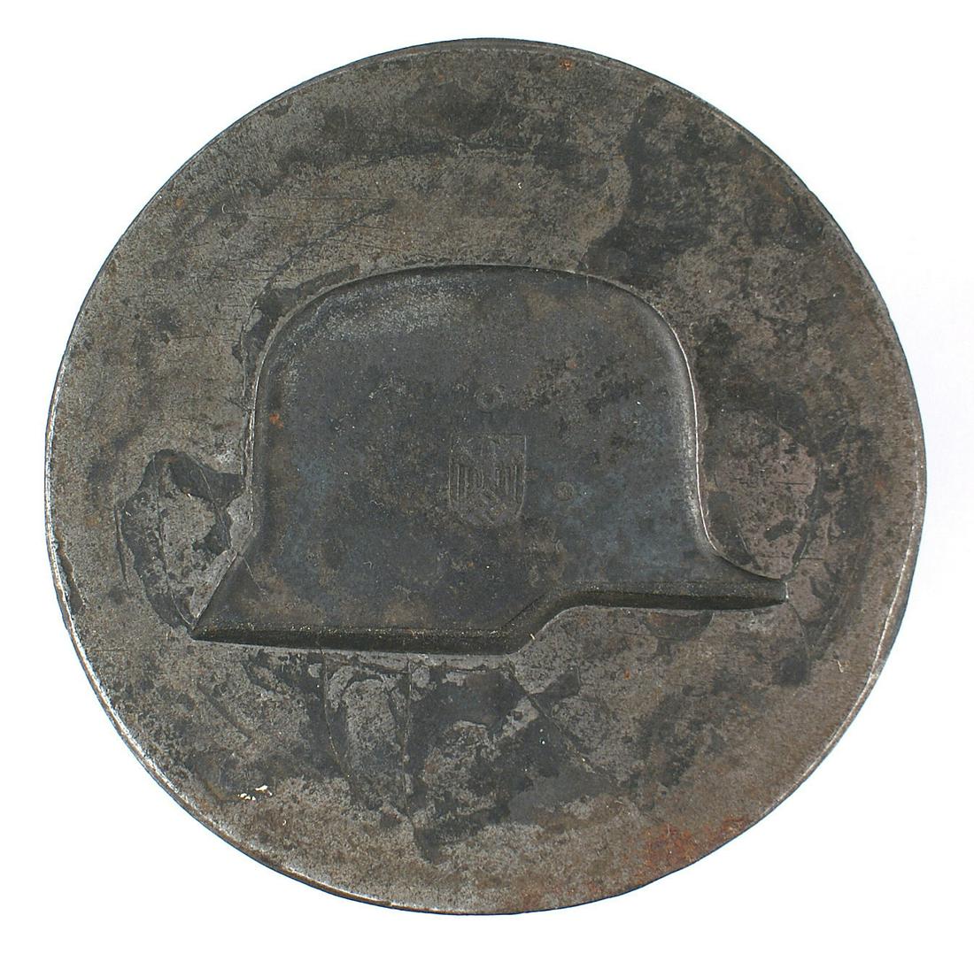 German WWII era steel die helmet: H-088 Third-Reich era steel die for a metal helmet profile used on the cover of a "Time of Military Service" photo album. 9 lbs. Opposite side used post-war for a "STADTPOLIZEI AMBERG" badge. Weight 8