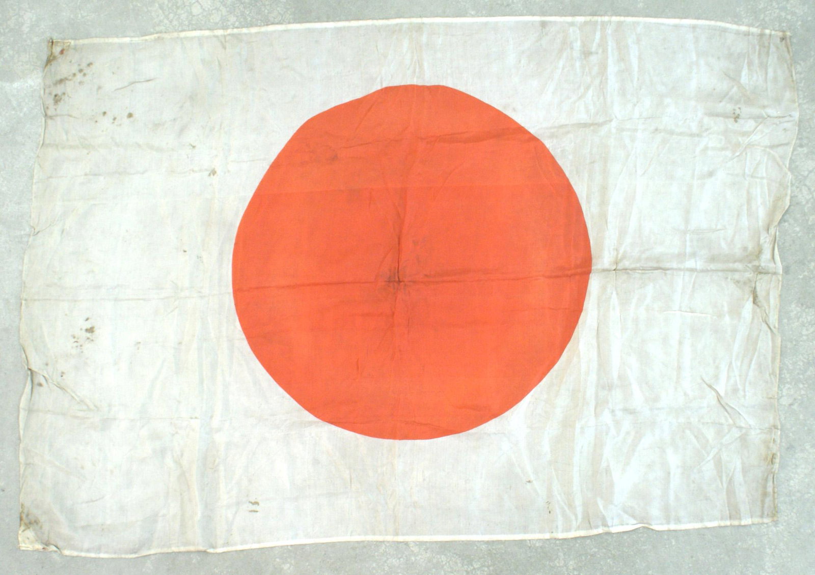 Japanese WWII silk meatball flag: H-110 Japanese WWII silk "meatball" flag. 24 1/2" x 6". Shows some age and wear (light spots). II