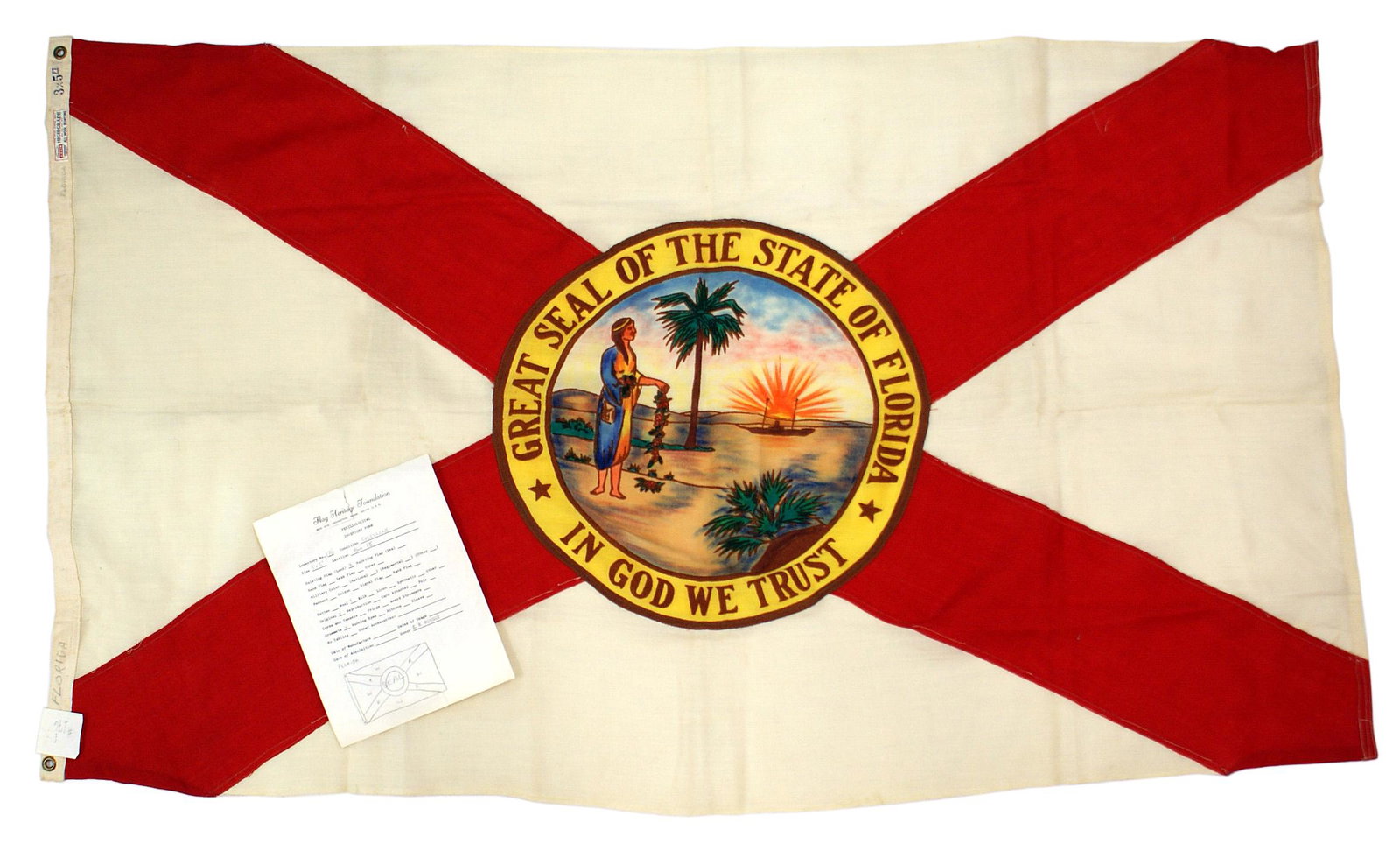 US State flag of Florida: K-035 State flag of Florida. Colorful state arms (an Indian, palm tree, ship and setting sun) on a red "X" with crossed 7 1/2" wide red panels - on a white field. With an "ANNIN" - "HIGH GRADE" label 