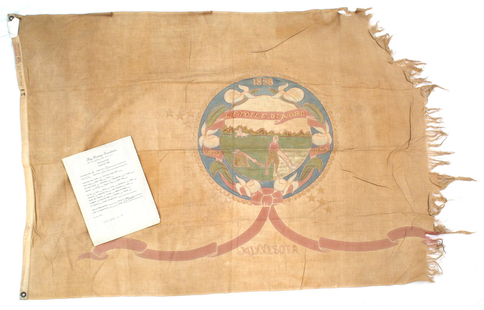 US State flag of Minnesota: K-041 State flag of Minnesota. Wreath with dates "1819-1858-1893" - holding a scene of a farmer with an Indian in the background. Ribbon at base with "MINNESOTA". With "DEFIANCE" label. 3' x 5'. Well 