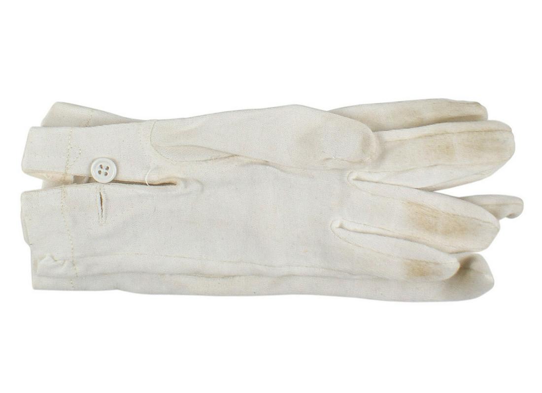 German WWII Army Waffen SS gloves: F-061 German WWII Army/Waffen-SS white cotton parade gloves. Three 3 1/2" white stitched lines extend from the knuckles towards the wrist. White button fastener. Lightly soiled. II