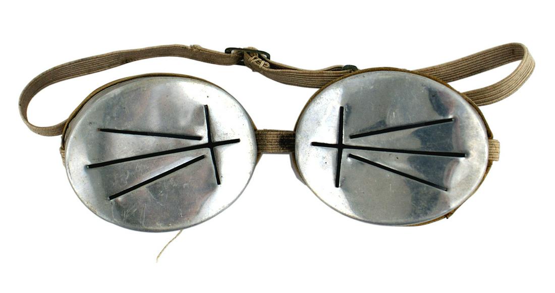 German WWII Army Mt. Troops snow goggles: N-011 German WWII Army Mt. Troops snow goggles. Aluminum eye covers with slits - on rubber frames with an elastic strap. II
