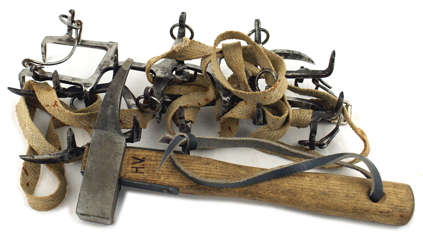 German WWII Gebirgs trooper lot pickaxe: N-013 German WWII "Gebirgs" trooper's issued field equipment: (1) "Ice creepers". Metal two-piece hinged boot form with spikes, ring attachments and cloth straps. Maker marked. (2) Ice hammer. 5 1/4" 
