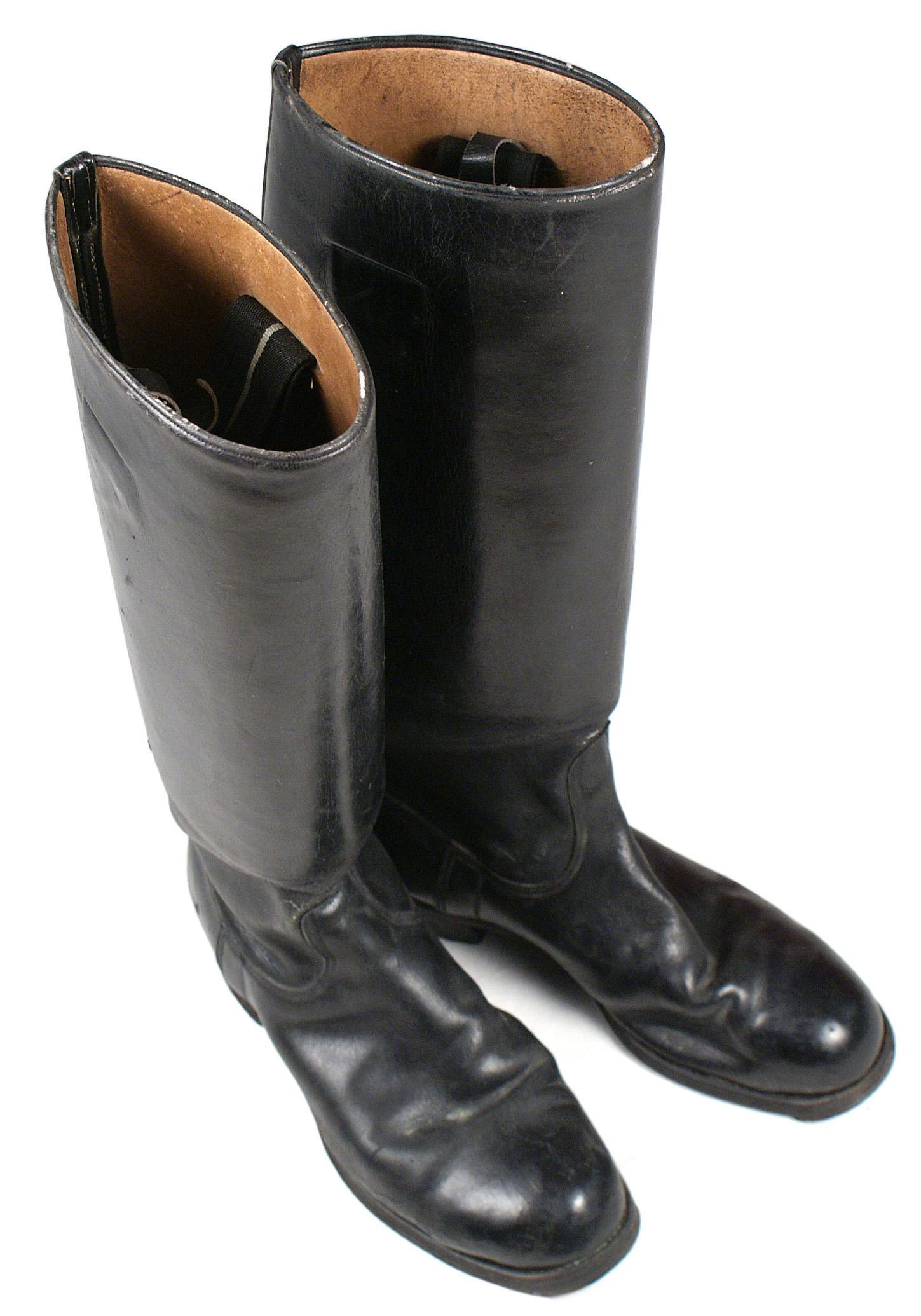 German WWII officer black leather boots: N-022 German WWII Officers black leather boots. Original leather soles with steel taps and horseshoe arrangement of nails in heels. Smooth leather shafts. 17" tall. Soles marked "8G". II