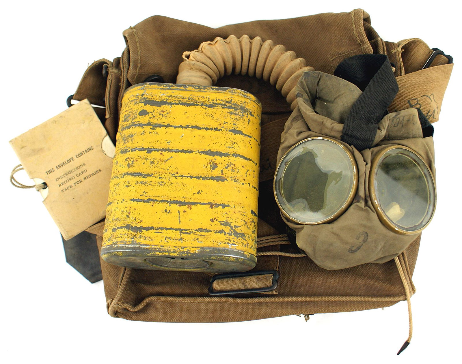 US WWI gas mask 2nd Anti Air Craft MG: N-026 US WWI gas mask. Complete with face mask, hose, filter can and haversack. Shoulder strap inked name of owner "Meh. - Leo Murray Co. C 2nd Anti Air Craft MG Bn. USA" II