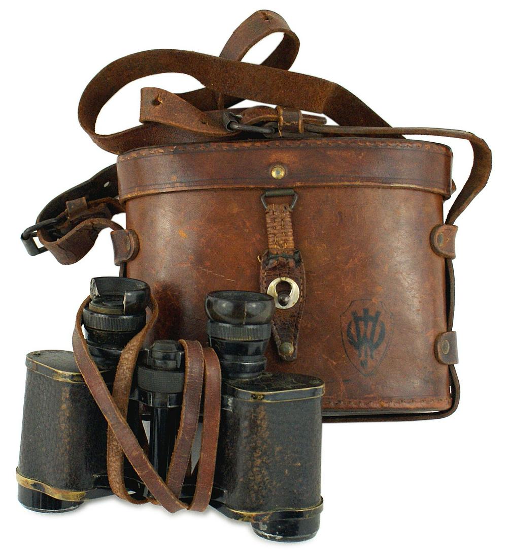 French WWI binoculars: N-041 French WWI binoculars. Marked "8X LUMINA SERIE C". One plastic eye frame is partially chipped away. Lenses are clear. With a leather neck strap and hard leather case with a shoulder strap. II