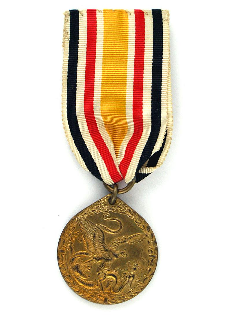 German Colonial China Medal Boxer Rebellion: B-007 German Colonial Service in China Medal (Boxer Rebellion). Obverse: Imperial German eagle attacking a Chinese dragon. Reverse: crowned "W", "1900-1901", etc. II