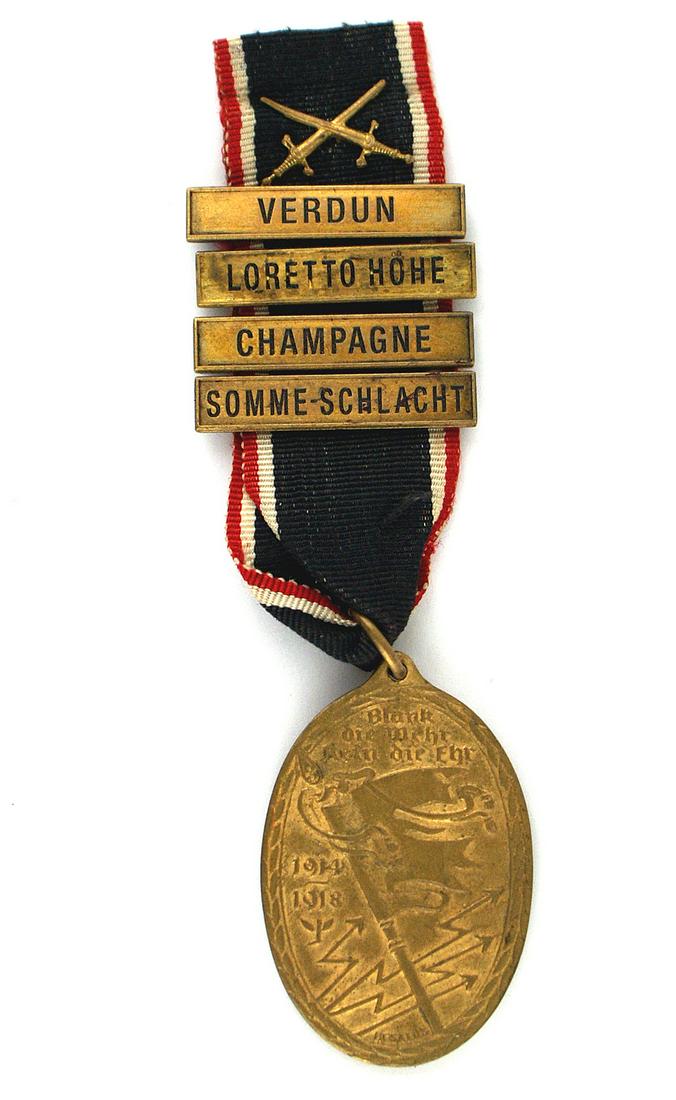 German Kyffhauserbund Medal WWI service: B-028 German Kyffhauserbund Medal for service in WWI. Crossed swords on the ribbon with four engagement bars: (1) "VERDUN". (2) "LORETTO HOHE". (3) "CHAMPAGNE". (4) "SOMME - SCHLACHT". II