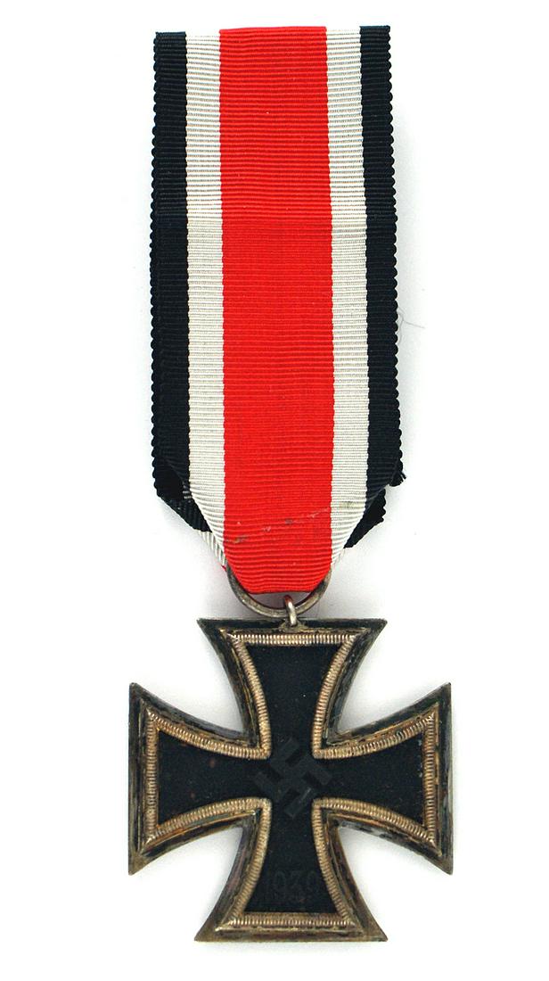 German WWII 1939 Iron Cross 2nd Class: B-079 German WWII 1939 Iron Cross Second Class. Type with a high swastika. Patina on the silver frame. Full ribbon. Ring marked "27" (Anton Schenkl - Vienna). II