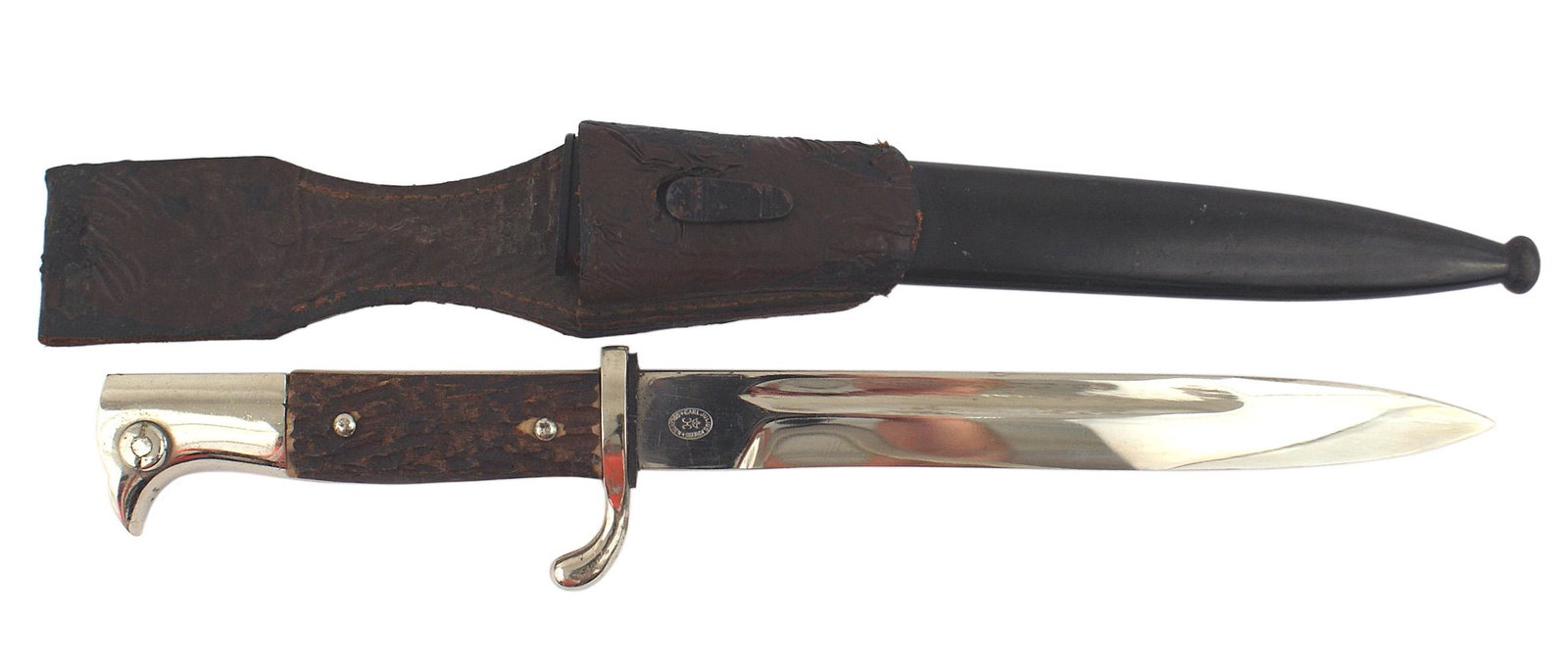 German WWII Mauser dress bayonet: D-062 German WWII Mauser dress bayonet. Pronounced nickeled bird-head pommel. Stag grips. Turned-up short crossguard. About excellent 7 3/4" blade - with name of maker "CARL JULIUS KREBS - SOLINGEN" w