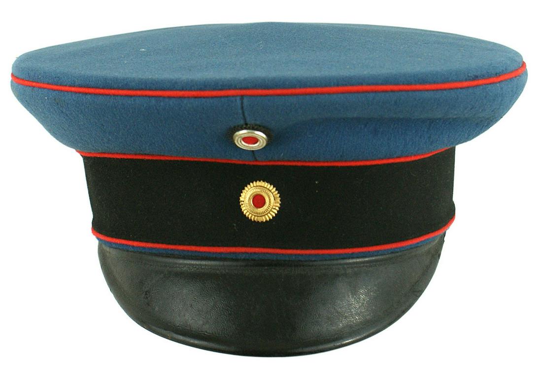 Imperial German Kaiser Wilhelm II peaked cap: A-001 Kaiser Wilhelm II peaked cap as Chief of the Baden 110th Grenadier Regiment. Medium blue doeskin with a red piped black band and crown. Quality National and Baden rosettes. Grained black vulcan 