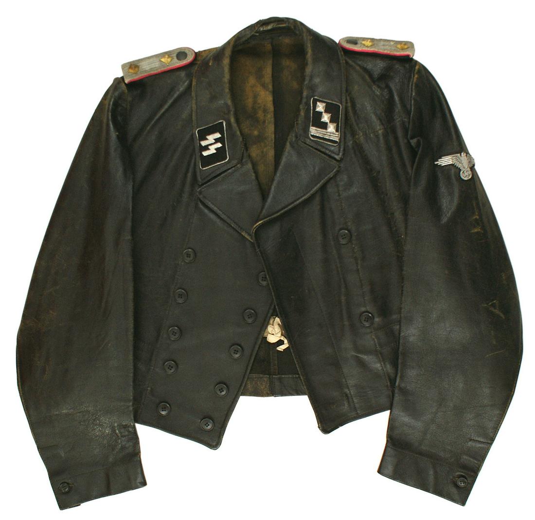 German WWII Waffen SS leather Panzer uniform: A-017 German WWII Waffen-SS black leather Panzer uniform. Includes: (1) Leather "wrapper" with two rows of six buttons each on the right front and two buttons on the left. Thread loops for two badges.