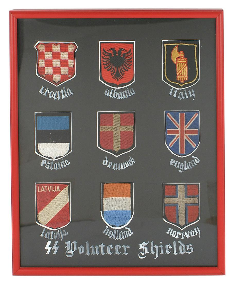 9 German WWII SS Volunteer Shields: H-051 Framed display of 9 German WWII "SS Volunteer Shields". Includes: Croatia, Albania, Italy, Estonia, Denmark, England, Latvia, Holland, and Norway. Nicely matted and framed. 12 1/2" X 10 1/2". 3 