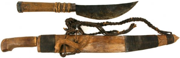 Lot of 2 South Pacific weapons golok and chopper: Lot of 2 South Pacific weapons: (1) "Golok". One-piece wood grip (split). Unusual shaped 15 5/8" straight back blade with a convex cutting edge. Darkened and lightly pitted. Wood scabbard with cord wr