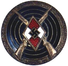 German Hitler Youth Sharp Shooter Badge: Hitler Youth Sharp Shooter Badge. Enameled HJ diamond/swastika and crossed rifles mounted on a black target with an oak leaf border. Reverse marked "RZM M1/14"