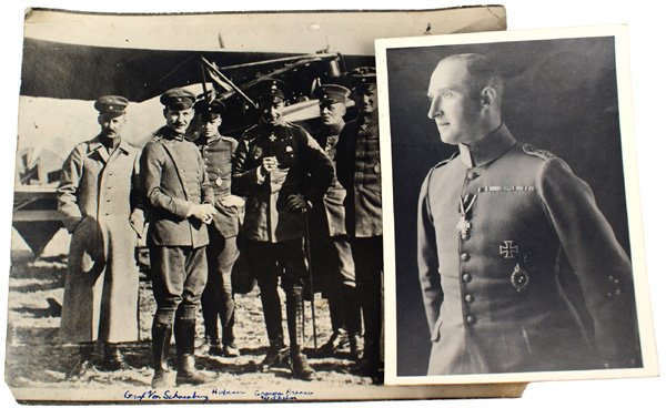 Lot of 2 German WWI aviation photos: Lot of 2 German WWI aviation photos: (1) Unknown pilot – wearing a Prussian House Order, 1st Class Iron Cross, Observer's Badge and a Wound Badge. 7" x 5". (2) Crown Prince Wilhelm with five officer
