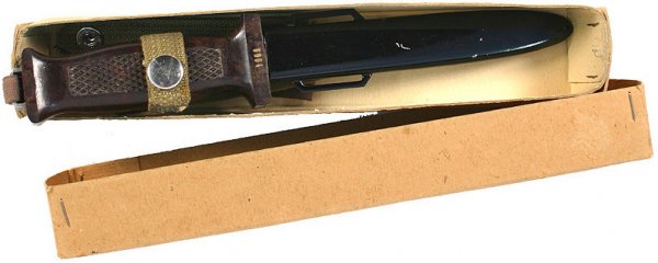 East German paratrooper knife dagger: D-41 East German paratrooper knife. Checkered bakelite grips with a hand cord attached to metal flange on pommel. Crossguard is numbered "7909". Mint 5 3/4" double-edged blade. Steel scabbard with two