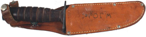 U.S. WWII knife IMPERIAL: D-56 "IMPERIAL - U.S.A." combat knife. Parkerized flat pommel, crossguard and 5 1/8" blade. Leather rings handle. With a civilian leather sheath. Named to "W. J. OGLE". Condition II+ $30.00