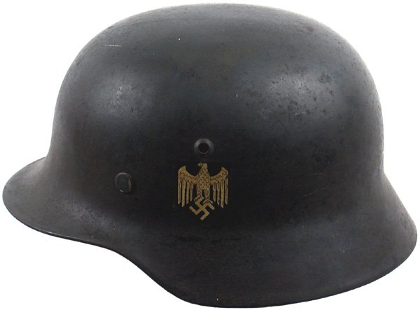 German WWII Navy helmet: E-28 Navy M1935 double-decal helmet. 99% original gold eagle/swastika decal - bottom left of shield is angled, some chips on border of National Colors. Green finish has an aged untouched patina. Tan "
