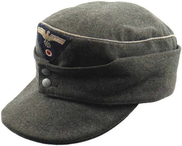 German WWII Army M1943 cap: E-149 Wartime officer's M43. Some areas of slight surface "matting". Aged silver wire cord piping around crown. Embroidered relief eagle/swastika/rosette on a dark green wool trapezoid. Maker stamping