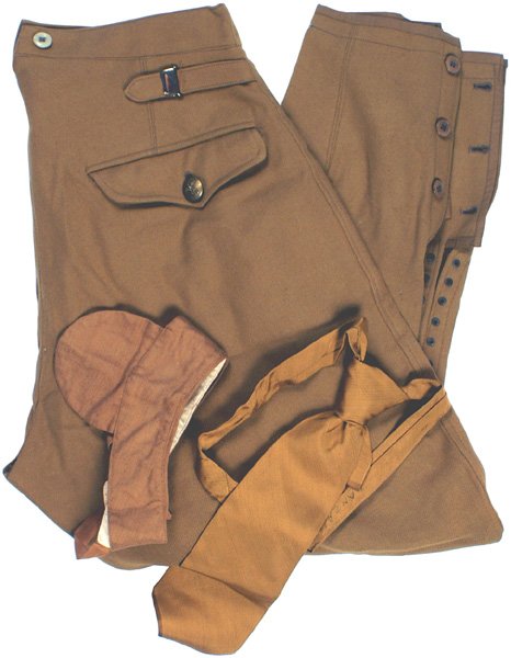 German WWII NSDAP pants: F-52 - N.S.D.A.P. Political Leader breeches. Fine golden brown material with two side and one back flap pocket (gilt eagle/swastika buttons). Lace-up bottoms. With a collar liner and necktie - both wi