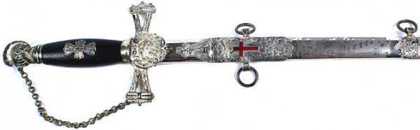 Masonic Knights Templar sword: K-82 - Silvered plumed knight's helmet pommel, chained knuckle-bow and "open" tapered crossguard with a shield shaped langet holding a relief crown/cross. 29" excellent blade with subdued gold washed