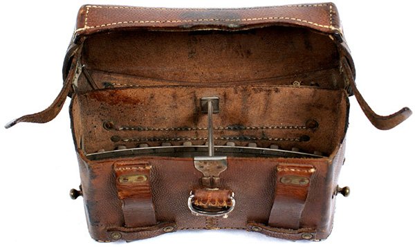 German WWI M1915 cartridge box: M-25 - German WWI M1915 leather cartridge box. Pebbled brown leather with side straps, belt loops and "D" ring. With metal separators. Inside lid maker marked, dated "1915" and stamped "121 R" (121st 