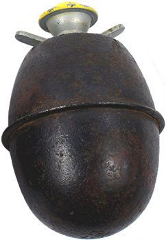German WWII egg grenade: M-45 - German WWII "egg" grenade. Raised seam around center. Bottom stamped "col 41". Top of spinner/fuse is painted yellow. II.....$75.00