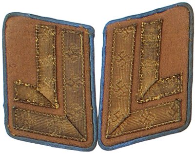 German WWII NSDAP collar tabs: H-31 - Zellenleiter collar tabs. Two gold tape "L's" on blue piped brown tabs. II-.....$30.00