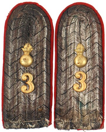 Prussian WWI officer shoulder boards: H-170 - Prussian Officer Field Artillery. Age toned silver wire with black "V's". Applied gilt brass flaming grenade and "3". Red underlay with some moth nips on the underside. II.....$50.00