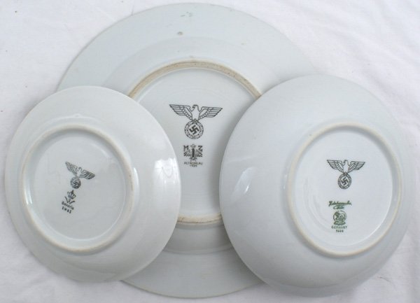Lot of German WWII porcelain plate: H-178 - Lot of 3 porcelain tableware: Large soup bowl, smaller dessert bowl and a saucer. The bottoms of all three are marked with an eagle/swastika, logo of maker, and David ("1939" and "1941"). II..