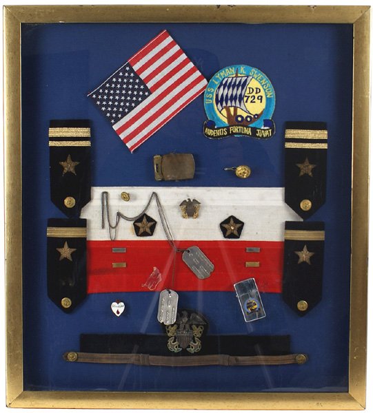 U.S. WWII Navy insignia framed: H-246 - Framed display of US Navy insignia. Includes: (1) American Flag. (2) "USS LYMAN K. SWENSON" embroidered jacket patch. (3) 2 pairs of officer shoulder boards (4) Dog tags. (5) Cap band with lar