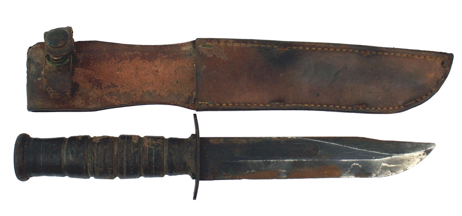 US Marine Corps WWII fighting utility knife: D-067 US Marine Corps WWII fighting/utility knife. Flat round pommel and unmarked crossguard. Leather washer grip. "USM.C." and "CAMILUS N.Y." marked 6 7/8" blade retains some bluing but shows wear as