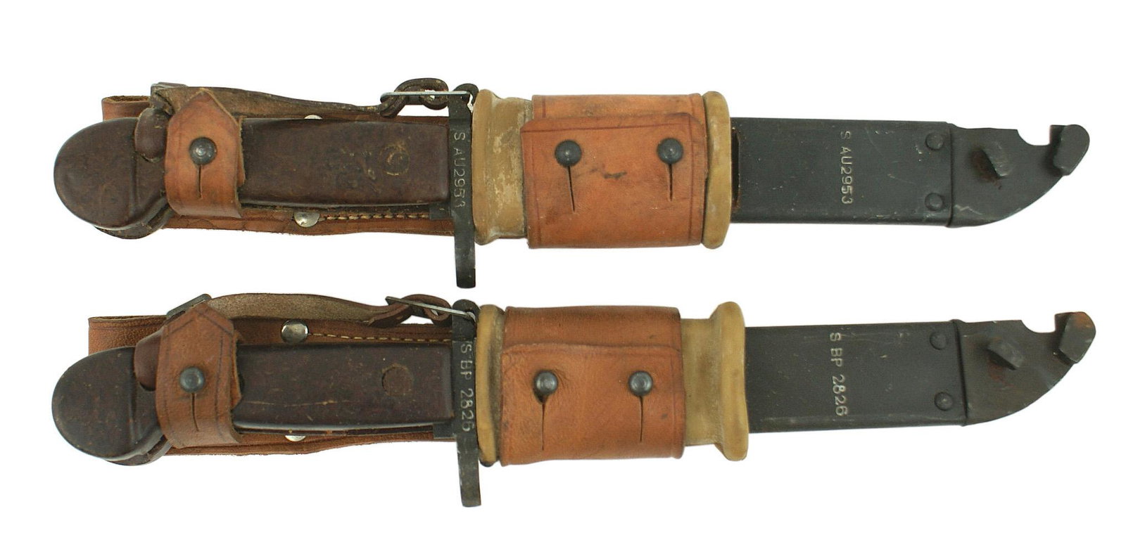 Soviet Russia Lot of 4Shtik Kalashnikova bayonets: D-124 Soviet Russia. Lot of 4 "old pattern" Shtik Kalashnikova bayonets. Unfullerd 5 7/8" bowie type blade with a serrated spine and elliptical hole near the tip (for attaching scabbard to use as wire