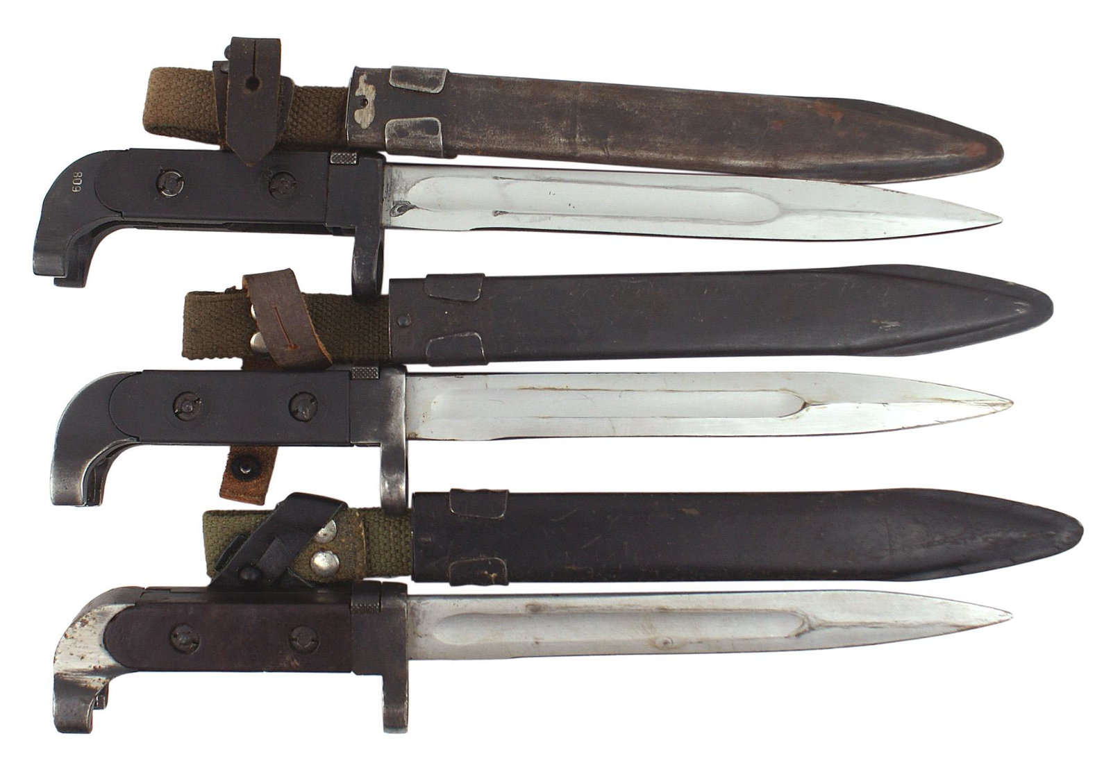 Soviet Russia Lot of 3 Type 1 bayonets: D-126 Soviet Russia. Lot of 3 AK-47, Type 1 bayonets. Blued steel "wrap around" pommel and crossguard muzzle ring. Two with black and one with brown plastic grips. 8" chrome plated blade with a dull f