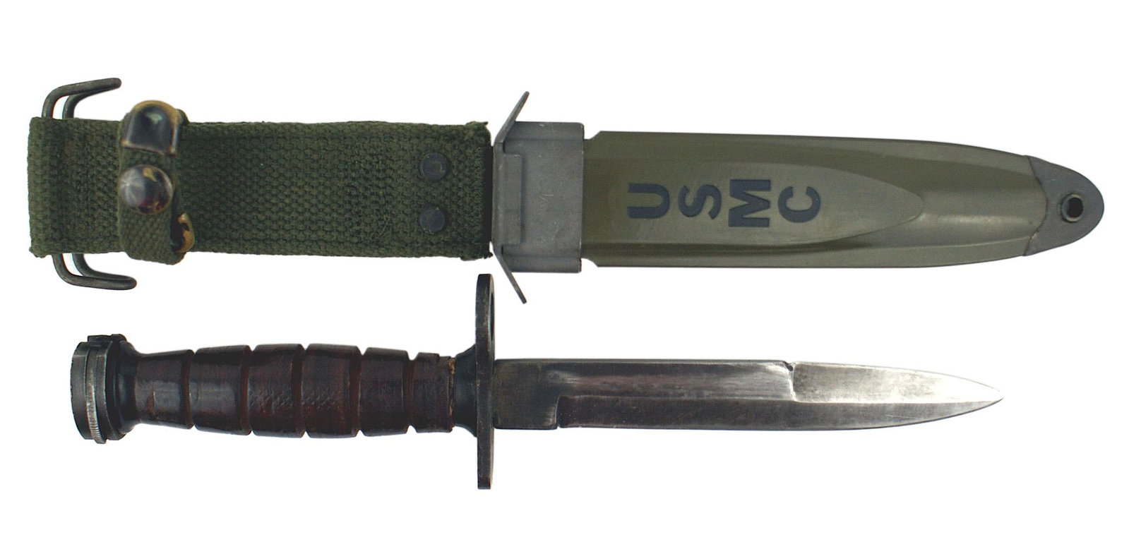 US WWII M-4 Bayonet for the M-1 Carbine: D-141 US M-4 Bayonet. Guard unmarked. 6 1/4" blade retains 50% of the blued finish and is marked "PORT. SWORD - JAPAN". Black plastic spacer at top and bottom of the leather washer handle. "USM8A1" ma
