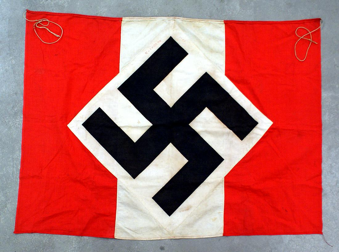 German WWII Hitler Youth Rostrum Banner flag: H-040 German WWII Hitler Youth Rostrum Banner. Large white diamond with white panel extension holding a tilted 18" x 18" black swastika - all on a red field. 30 1/2" x 41 1/2". Reverse has a fading in