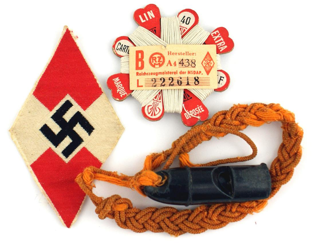 German WWII Hitler Youth lot badge whistle thread: H-064 Lot of German WWII Hitler Youth items: (1) Bevo embroidered member's "diamond" sleeve badge. Original "RZM" paper tag on reverse. (2) Bakelite whistle with a twisted orange lanyard. (3) Unused T
