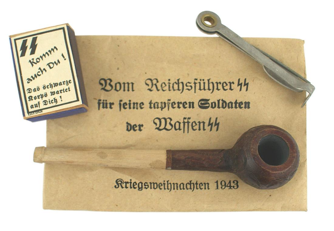 German WWII Christmas gift pipe Waffen SS: H-078 Christmas gift pipe to members of the Waffen-SS, Wood bowl/stem with an iron ring which shows age. Also with a tamper/packer and an "SS" labeled box of matches. Paper envelope reads "From the Re