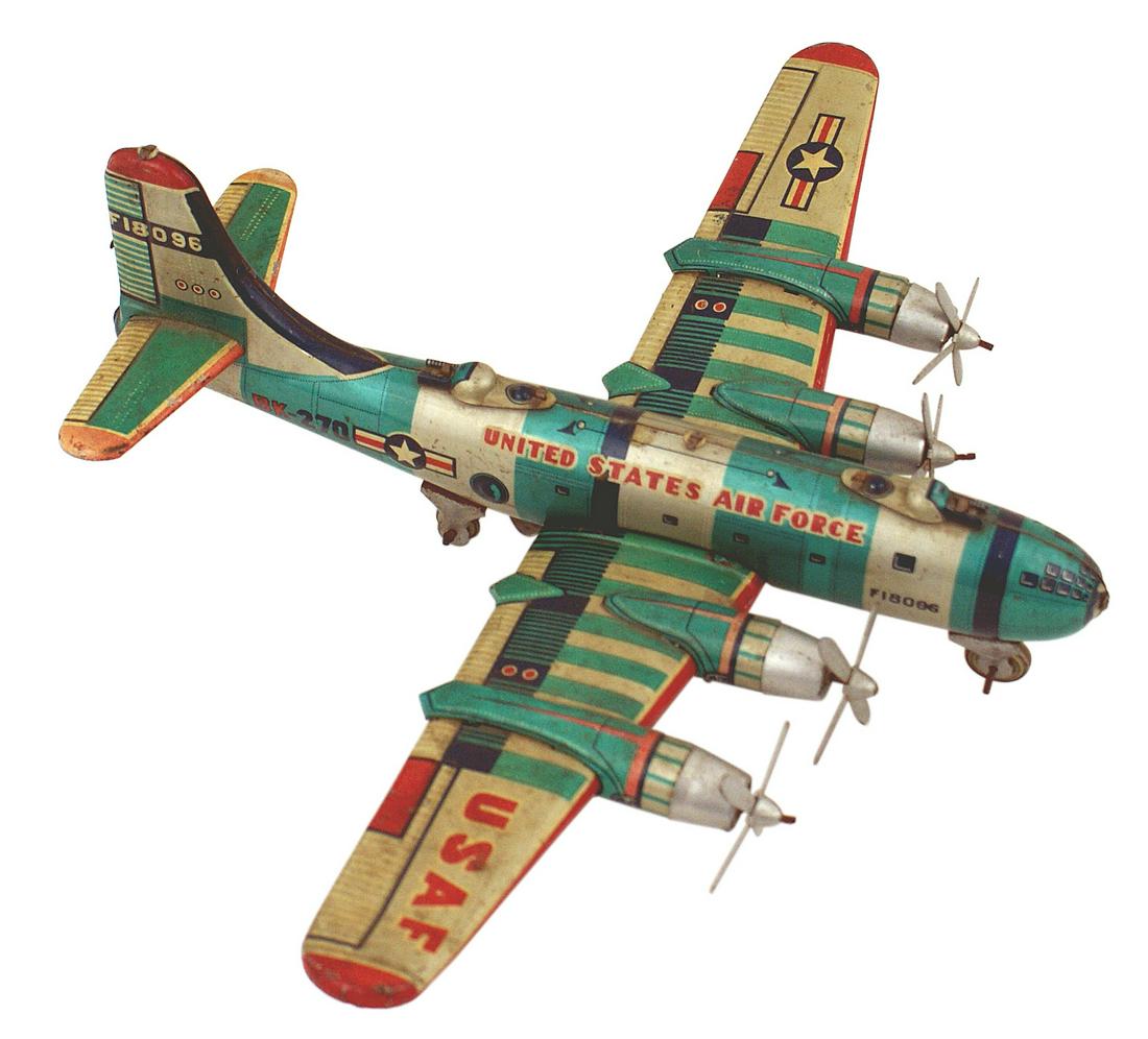 Japanese toy model of a US WWII B-29: H-160 Japanese, well-made toy model of a US WWII B-29. Lithographed 3-dimensional body and wings. Well marked with insignia and "UNITED STATES AIR FORCE". Four engines with movable props and wheels. M