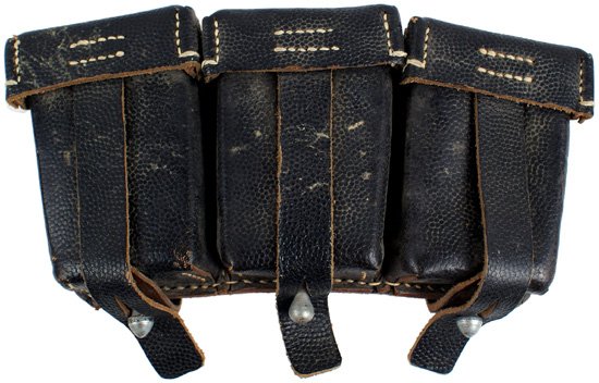 German WWII K98 cartridge pouche: M-70 Single cartridge box, as above. Black pebbled leather. Reverse is stamped with maker "KURT SEIDEL BERLIN". Condition II+..........25.00