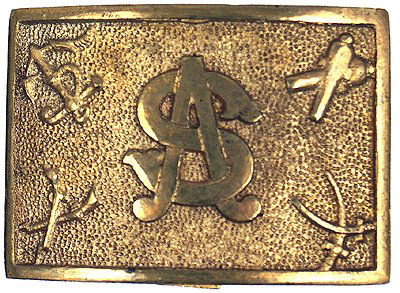 Sons of Civil War Veterans buckle: K-60 Sons of Civil War Veterans. Convex, brass with "polished" gilt relief "SV" in center and military emblems (crossed swords, rifles, etc.) in corners. Stippled background and a relief "polished" gi