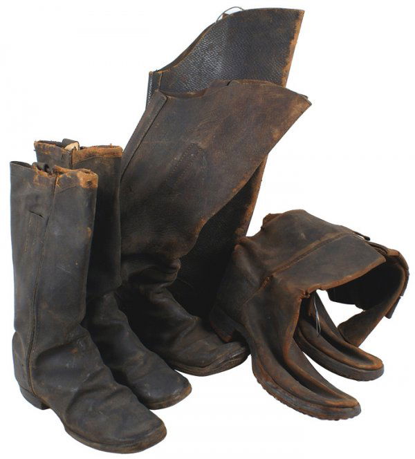 Lot of Civil War Cavalry boots: K-77 Lot of Civil War Cavalry boots. Includes: (1) Set of two left feet. Height comes below knee and are slanted towards the back. One has a period repair on the sole and shows wear. (2) Pair. Standar