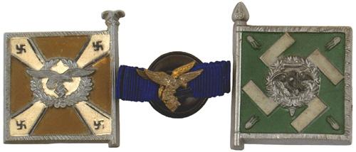Lot of 2 German WWII Luftwaffe pins: B-150 Lot of 2 Luftwaffe pins: (1) Hermann Goring Regimental flag. (2) Luft Signal Standard. Also (3) Luft buttonhole device with two blue ribbons and two medal Luft eagle/swastika attachments. II