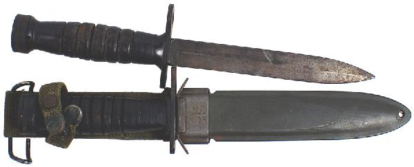 Lot of 2 U.S. WWII Mark 4 combat knife bayonet: D-92 Lot of 2 U.S. WWII Mark 4 combat knife/bayonets: (1) Darkened flat pommel with a locking device. Leather "rings" handle. Crossuard/muzzle ring – marked with a flaming grenade and "US M4 K1". 6 