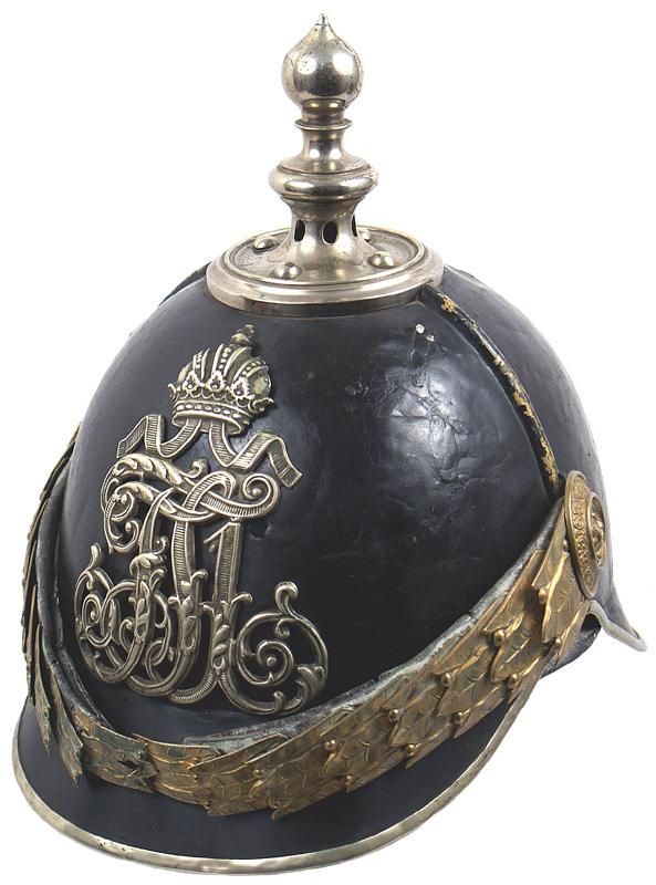 Imperial Austrian Vienna Security Police M1884 hel: E-5 Vienna Security Police M1884 helmet. Black lacquered metal body with nickeled trim and tiered ball top spike with base. Crowned "FJ1" cypher frontplate. Several small "spiders" on body. Gilt oak l