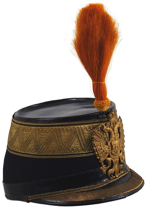 Imperial Austrian Infantry shako helmet: E-8 Infantry Leutnant/Oberleutnant shako. Same as above – but with a single 48mm gold bullion braid towards crown. Brim and cord as above. Gilt eagle frontplate. Orange horsehair plume. Embossed gol