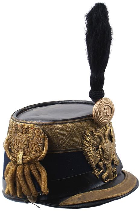 Austrian Colonel General Staff shako helmet: E-14 Colonel General Staff shako. Similar to above – but with a 1 7/8" gold bullion band, 3/4" wide gilt metal visor border and a 4" x 3 1/4" eagle frontplate. 5 1/2" black horsehair standup plume.